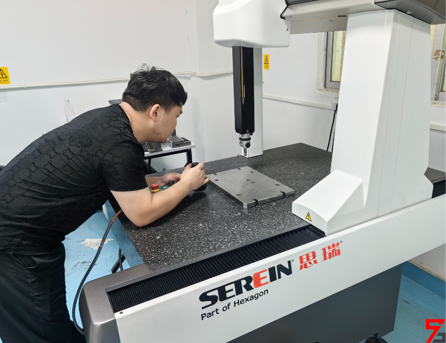 Worker operates the CMM