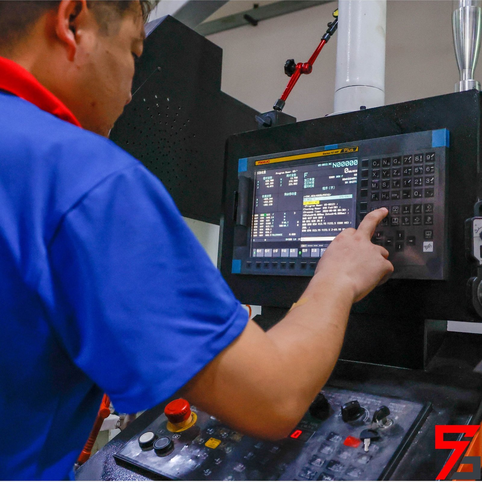 The worker is adjusting the machine